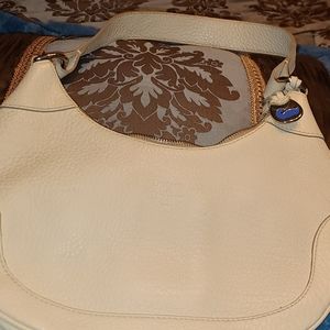 Dooney & Bourke  Leather Hobo Bag.  Interior of the bag has some makeup spots.